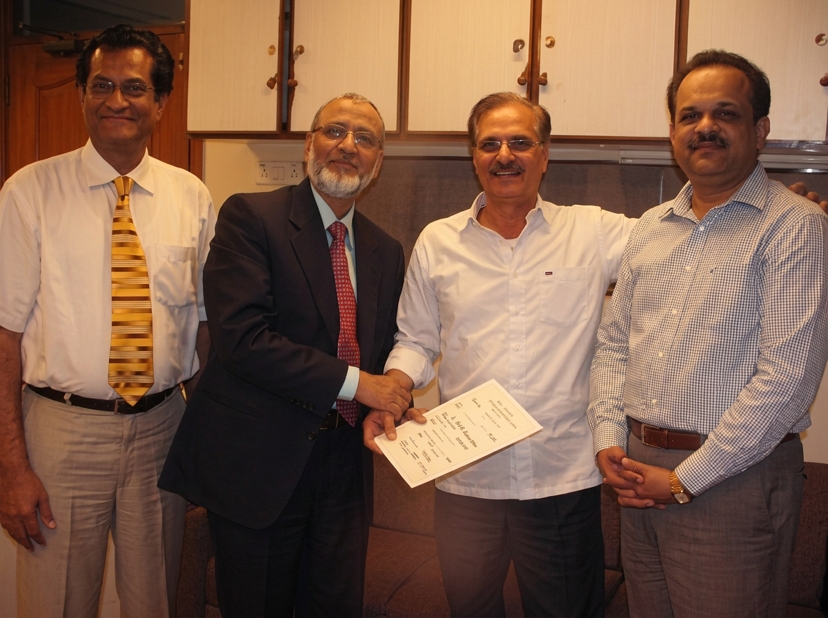 Four WTAP members presenting a certificate at an association gathering