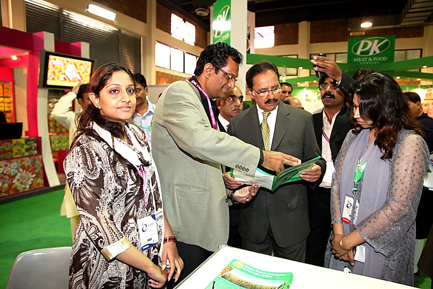 Federal minister being briefed at the WTAP stand during an international food exhibition